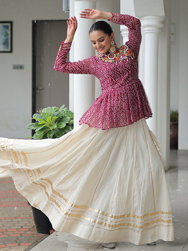 Maroon Bandhani Printed Kutchi Gamthi Work Top With Off White Lehenga