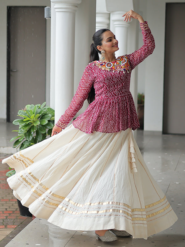 Maroon Bandhani Printed Kutchi Gamthi Work Top With Off White Lehenga