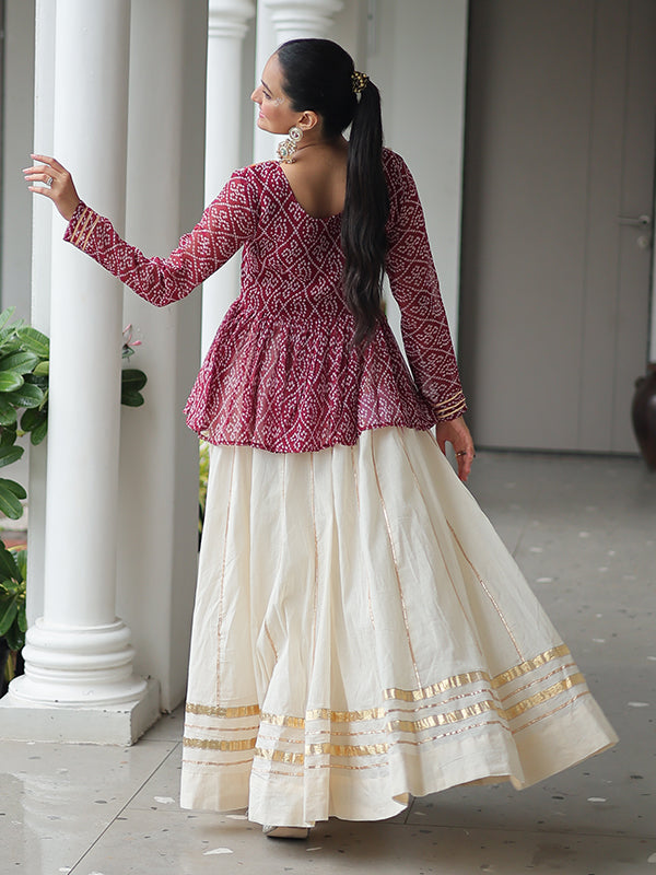 Maroon Bandhani Printed Kutchi Gamthi Work Top With Off White Lehenga