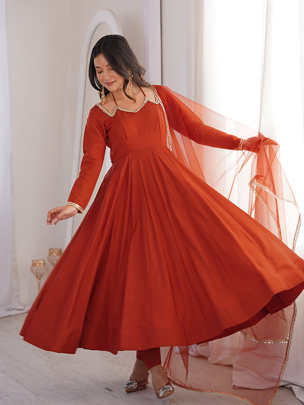 Rust Orange Roman Silk Chanderi Umbrella Flair Gown With Net Dupatta