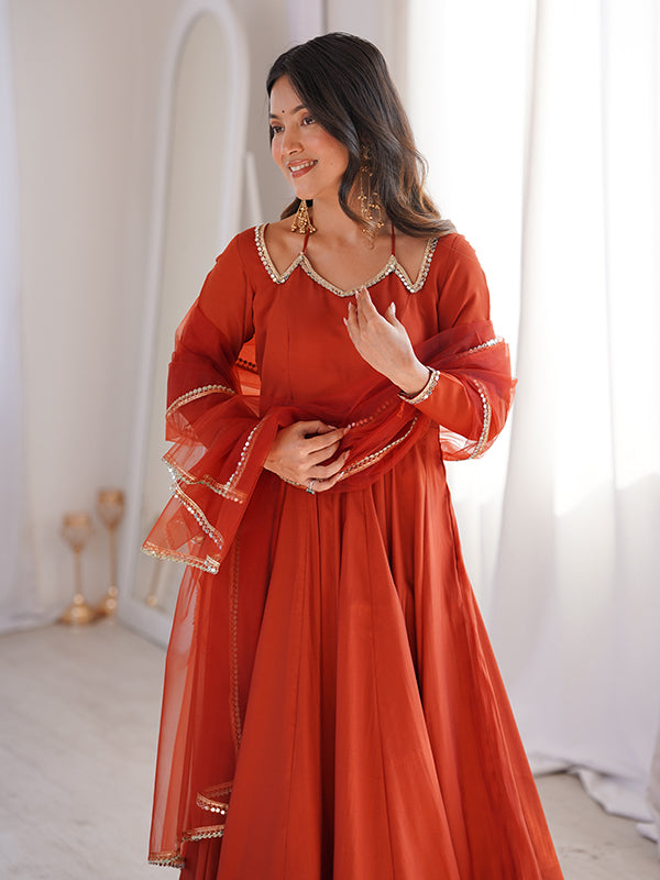 Rust Orange Roman Silk Chanderi Umbrella Flair Gown With Net Dupatta