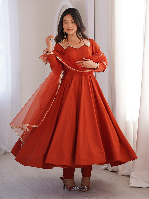 Rust Orange Roman Silk Chanderi Umbrella Flair Gown With Net Dupatta
